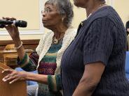 Laney Stevenson thanks the commission for the proclamation honoring her late husband, John Stevenson's, life and legacy