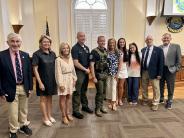 Corporal Jordan Taylor with family and Commission